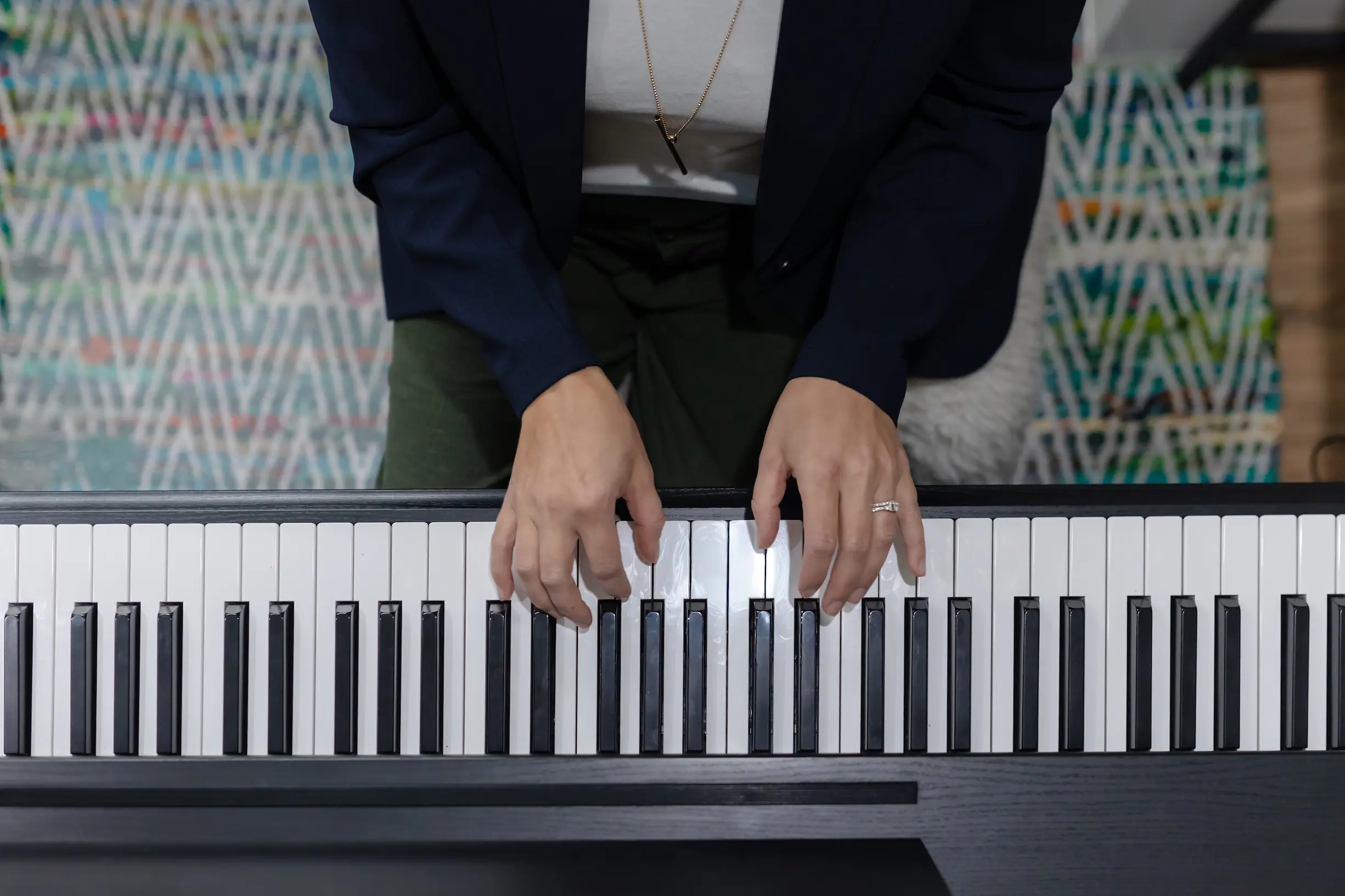 NewSong Academy London Ontario Voice Lessons Expert Teacher Suzanne Schaafsma playing the piano to accompany her students.